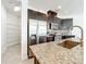 This modern kitchen features granite countertops, stainless steel appliances and walk in pantry at 14014 Millington St, Orlando, FL 32832