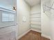 Walk-in closet offers ample storage space with wire shelving at 14014 Millington St, Orlando, FL 32832