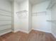 Spacious walk-in closet featuring wire shelving and carpeted floors for convenient storage and organization at 14014 Millington St, Orlando, FL 32832