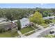 Aerial view of the home showcasing a mature tree and a well-manicured lawn at 145 Burns Ave, Longwood, FL 32750