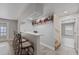 This house features a bar with a red shelf for liquor and wine glass storage above at 145 Burns Ave, Longwood, FL 32750