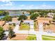 Stunning aerial view of a lovely home with beautiful lake views, set in a serene neighborhood at 14723 Peppermill Trl, Clermont, FL 34711