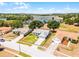 Aerial view of a lovely home with a beautiful lake view, surrounded by lush greenery at 14723 Peppermill Trl, Clermont, FL 34711