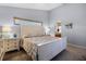 A bright bedroom with a white bed set, ample lighting and calm atmosphere at 14723 Peppermill Trl, Clermont, FL 34711