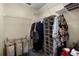 Walk-in closet with wire shelving, hanging clothes and additional storage at 14723 Peppermill Trl, Clermont, FL 34711
