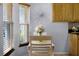Bright dining area with hardwood floors, window with coverings, and a floral centerpiece at 14723 Peppermill Trl, Clermont, FL 34711