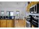 Stylish kitchen features stainless steel appliances and breakfast bar at 14723 Peppermill Trl, Clermont, FL 34711