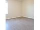 Bright bedroom featuring a window and wood-look floors at 14867 Driftwater Dr, Winter Garden, FL 34787