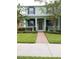 Charming two-story home with a well-maintained lawn and inviting entryway at 14867 Driftwater Dr, Winter Garden, FL 34787