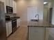 Modern kitchen featuring stainless steel appliances and granite countertops at 14867 Driftwater Dr, Winter Garden, FL 34787