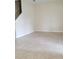 Bright and airy living room features tile flooring and staircase access to the upper level at 14867 Driftwater Dr, Winter Garden, FL 34787