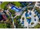 Aerial view of the community water park featuring a wave pool, splash pad, and playground at 1569 Carey Palm Cir, Kissimmee, FL 34747