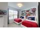 The bedroom has two twin beds with Marvel-themed decor, creating a fun and vibrant space at 1569 Carey Palm Cir, Kissimmee, FL 34747