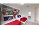 The bedroom has two twin beds with Marvel-themed decor, creating a fun and vibrant space at 1569 Carey Palm Cir, Kissimmee, FL 34747