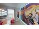 The bedroom features a bunkbed and a decorative mural of Rapunzel on the wall at 1569 Carey Palm Cir, Kissimmee, FL 34747