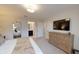 This bedroom features a TV, beige dresser, and a comfortable bed with neutral tones at 1569 Carey Palm Cir, Kissimmee, FL 34747