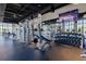 Community gym with weight machines, free weights, and large screen for entertainment at 1569 Carey Palm Cir, Kissimmee, FL 34747