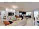 Open-concept living area featuring a decorative wall, modern furnishings, and a seamless flow to the kitchen at 1569 Carey Palm Cir, Kissimmee, FL 34747