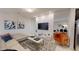 Contemporary living room featuring stylish decor, modern furniture, and ample natural light at 1569 Carey Palm Cir, Kissimmee, FL 34747