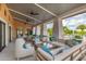 Outdoor covered lounge area offers comfortable seating, ceiling fans, and a relaxing view of the community pool at 1569 Carey Palm Cir, Kissimmee, FL 34747