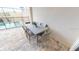 Outdoor patio with dining table set next to a pool with a safety fence at 1569 Carey Palm Cir, Kissimmee, FL 34747