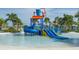 Community water park featuring a thrilling water slide and splash bucket play area for residents at 1569 Carey Palm Cir, Kissimmee, FL 34747