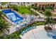 Aerial view of the Solara Resort's water park with a wave simulator and swimming pools at 1569 Carey Palm Cir, Kissimmee, FL 34747