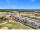 Aerial view of homes along the golf course, each with a private pool at 15727 Vetta Dr, Montverde, FL 34756
