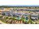Aerial view of backyards with pools, lush landscaping, and outdoor living spaces at 15727 Vetta Dr, Montverde, FL 34756