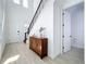 Bright foyer with modern fixtures, an elegant wooden cabinet, and white walls, creating a welcoming entrance at 15727 Vetta Dr, Montverde, FL 34756