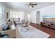 Open living area features modern furnishings, a decorative rug, and ample natural light at 15727 Vetta Dr, Montverde, FL 34756