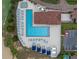 Aerial view of a large community pool with lounge chairs and well-maintained landscaping at 15727 Vetta Dr, Montverde, FL 34756
