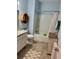 Well-appointed bathroom with a tub-shower combination, wood-look flooring, and updated vanity and fixtures at 2075 Huntsman Ridge Rd, Clermont, FL 34715