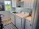 Well-equipped laundry room featuring modern appliances and ample storage space at 2075 Huntsman Ridge Rd, Clermont, FL 34715