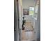 Functional laundry room with appliances, storage, and natural light from the window at 2075 Huntsman Ridge Rd, Clermont, FL 34715