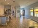 Open-concept living room with hardwood floors and plenty of natural light at 2075 Huntsman Ridge Rd, Clermont, FL 34715