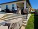 Outdoor patio with steps leading to a covered area, perfect for entertaining or relaxing at 2075 Huntsman Ridge Rd, Clermont, FL 34715