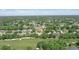 Overhead view of the home and its proximity to the golf course and lush greenery at 216 Hammock Oak Cir, Debary, FL 32713