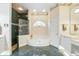 Bathroom with a step-up tub, separate shower, and white vanity with gold fixtures at 216 Hammock Oak Cir, Debary, FL 32713
