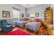 Charming bedroom featuring twin beds, complementary decor and natural light from the window at 216 Hammock Oak Cir, Debary, FL 32713