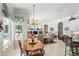 Cozy breakfast nook with backyard views, adjacent to a living area with fireplace and a full kitchen at 216 Hammock Oak Cir, Debary, FL 32713
