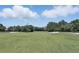 Expansive view of the golf course, with bright green grass and sand traps at 216 Hammock Oak Cir, Debary, FL 32713