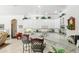 Bright kitchen features white cabinets, a breakfast bar, and modern appliances, providing a functional cooking space at 216 Hammock Oak Cir, Debary, FL 32713