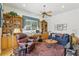 Cozy living room with a ceiling fan, built-in bookshelves, and comfortable seating at 216 Hammock Oak Cir, Debary, FL 32713
