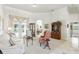 Bright living room featuring neutral colors, tile floors, and elegant furnishings with views of the backyard at 216 Hammock Oak Cir, Debary, FL 32713