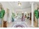Bright living room featuring neutral colors, tile floors, and elegant furnishings with views of the backyard at 216 Hammock Oak Cir, Debary, FL 32713