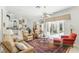 Bright living room with sliding glass doors to the outdoor patio and pool area, and comfortable seating at 216 Hammock Oak Cir, Debary, FL 32713