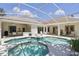 A beautiful pool surrounded by pavers that is great for entertaining and relaxation at 216 Hammock Oak Cir, Debary, FL 32713