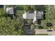 Overhead view of the house showcasing its architectural design, yard, and outdoor fire pit feature at 246 N Oak Ave, Orange City, FL 32763