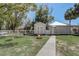 Cozy backyard features a fire pit, a shed, and a fenced-in yard at 246 N Oak Ave, Orange City, FL 32763